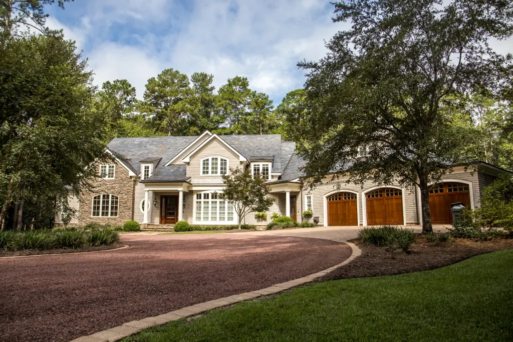 Luxury Craftsman Estate with Gravel Circular Driveway Three Car Garage and Stone Accents.jpg