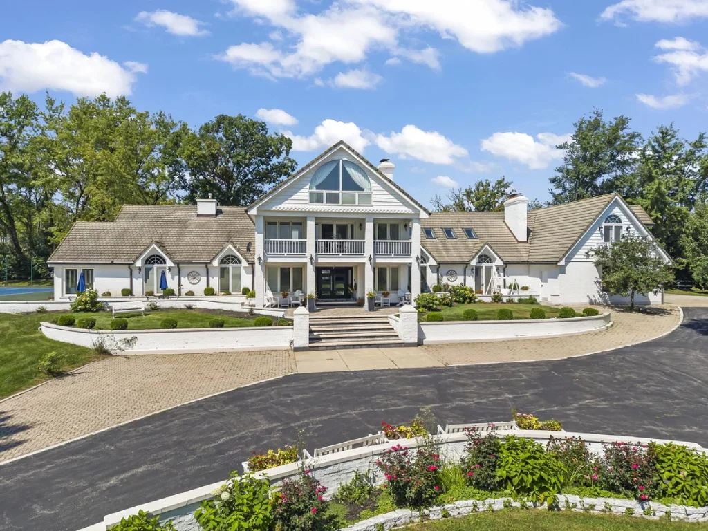 Sprawling White Luxury Estate with Circular Driveway Balcony and Tennis Court.jpg